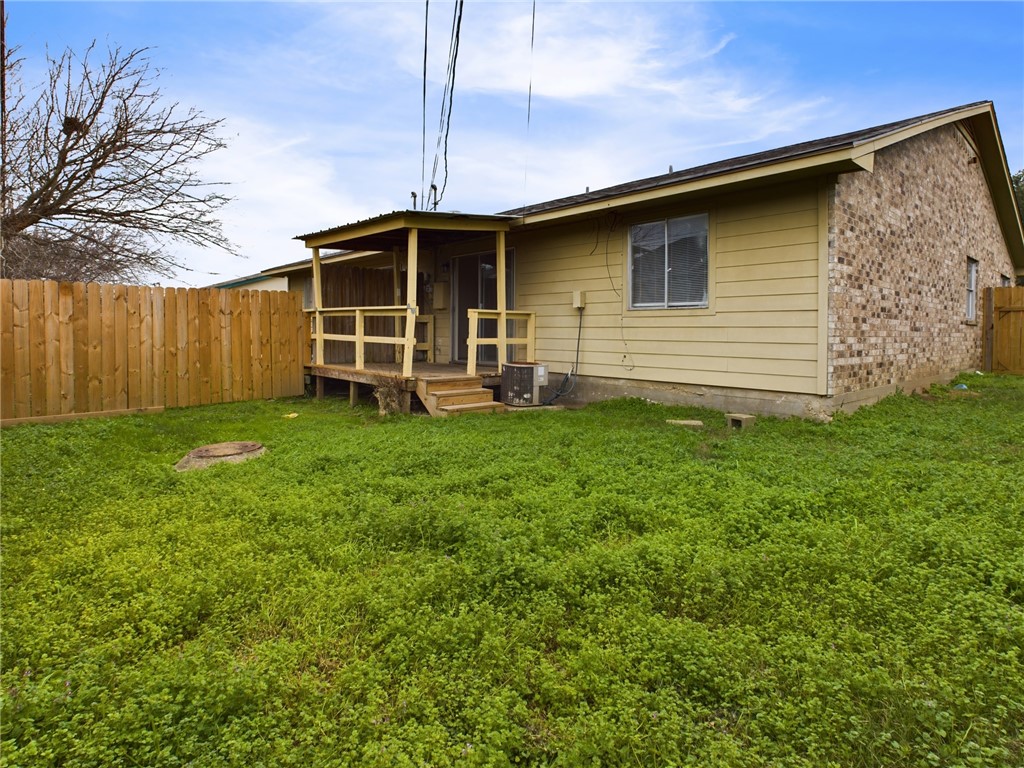 1221 April Bloom, Unit AB College Station, TX 77840 - Photo 29 of 31 a front view of a house with a yard