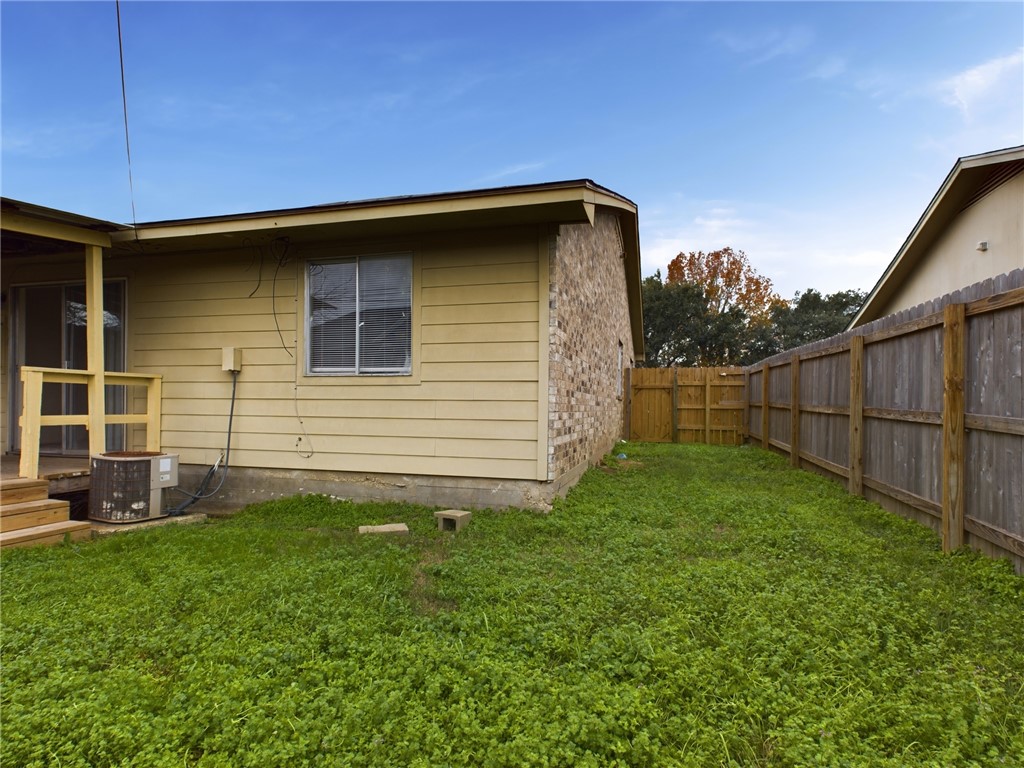 1221 April Bloom, Unit AB College Station, TX 77840 - Photo 30 of 31 a backyard of a house with lots of green space