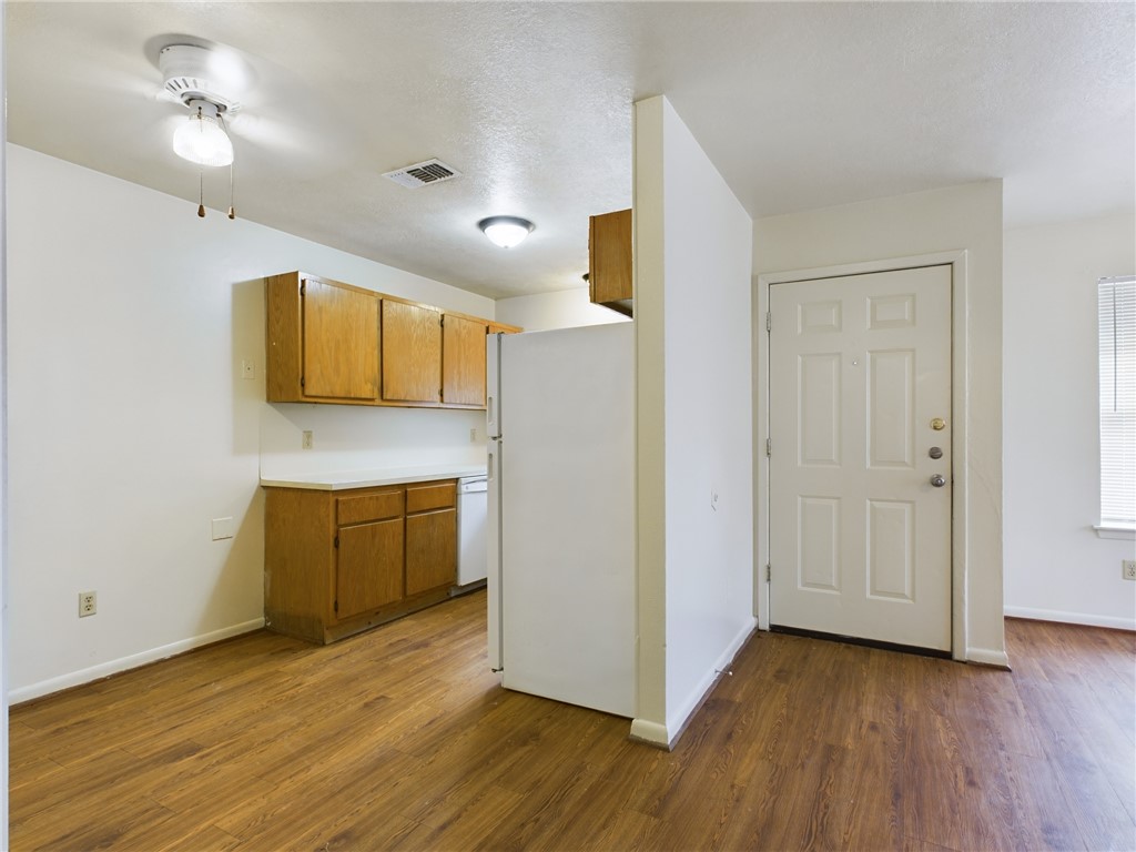 1221 April Bloom, Unit AB College Station, TX 77840 - Photo 9 of 31 a view of kitchen with wooden floor and electronic appliances