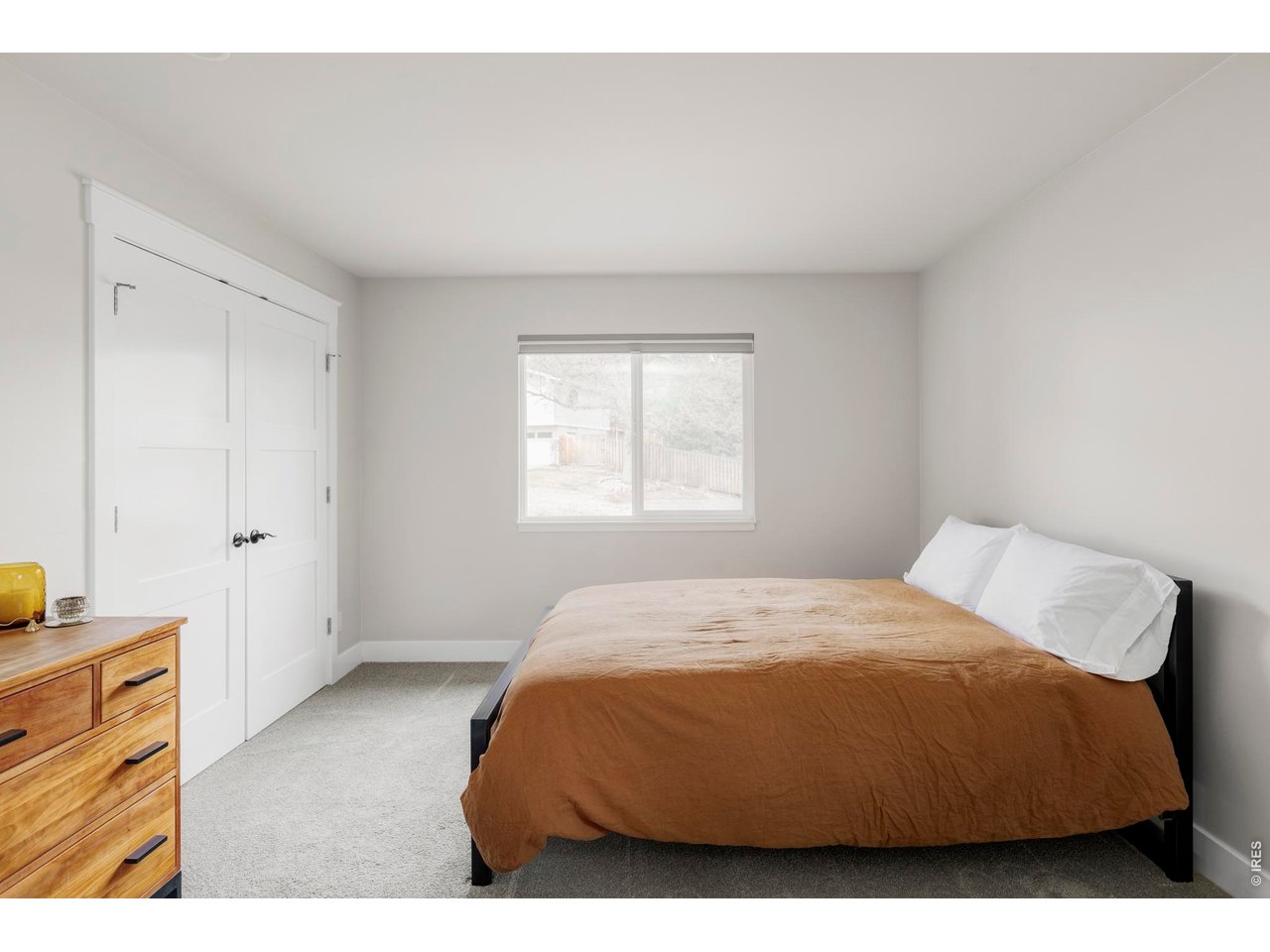 646 Furman Way Boulder, CO 80305 - Photo 13 of 38 The primary bedroom is positioned on the main floor, offering privacy and a layout that supports long-term livability.