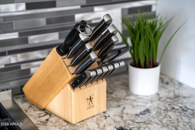 a bathroom with a white tub a sink and vanity