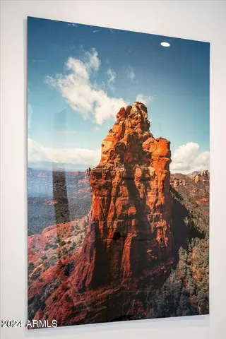 a bedroom with a bed and ceiling fan
