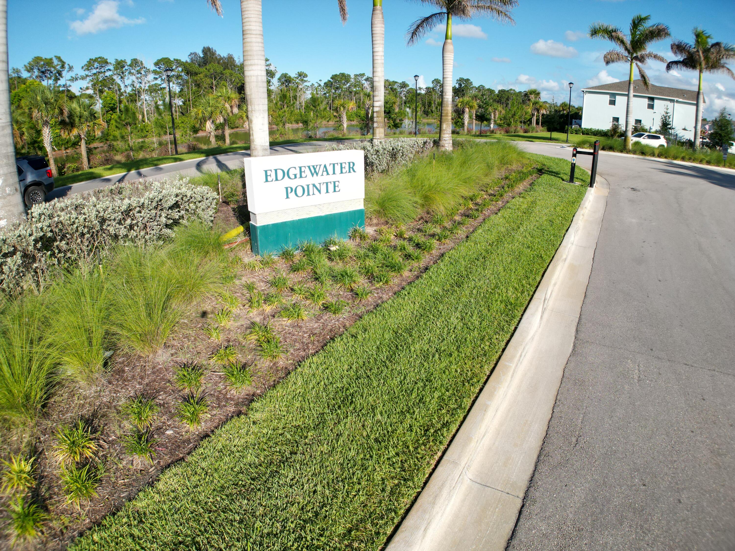 5784 Southeast Edgewater Circle Stuart, FL 34997 - Photo 30 of 33 a view of a street with a building in the background