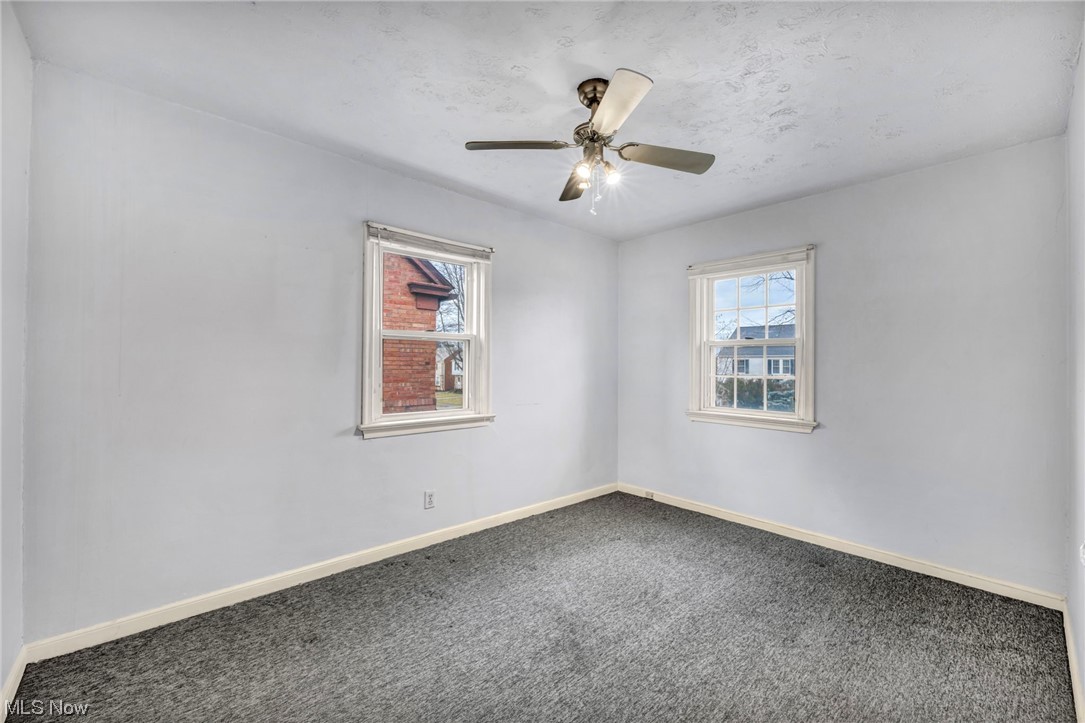 3946 Lansdale Road Cleveland, OH 44118 - Photo 33 of 42 Unfurnished room featuring dark colored carpet and ceiling fan