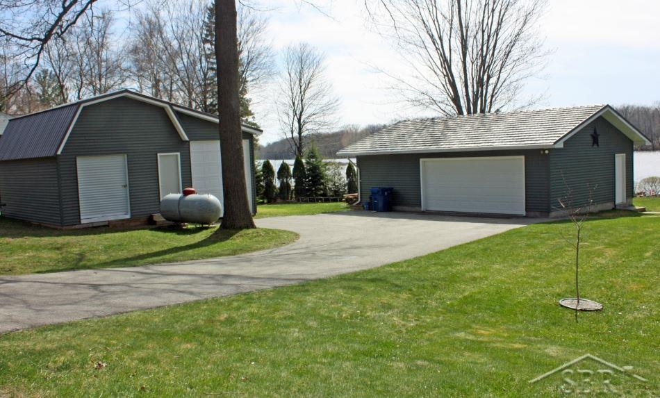 3072 South Whitney Beach Road Beaverton, MI 48612 - Photo 3 of 21 Well maintained black top drive with lots of parking.