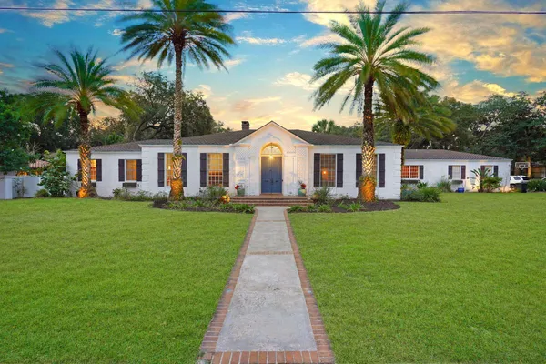 a front view of a house with garden