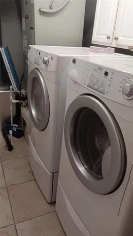 a bathroom with a granite countertop toilet and a sink
