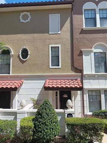 front view of a house with a garden