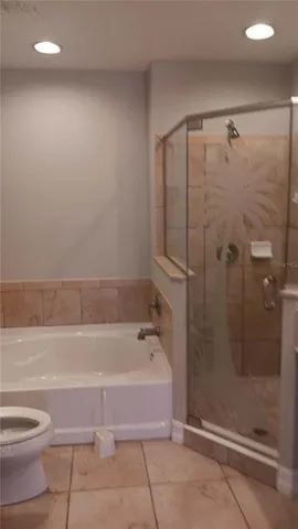 a bathroom with a sink a toilet and bathtub