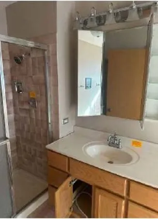 a bathroom with a sink and a mirror