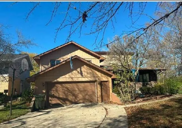 a view of a house with a snow in the yard