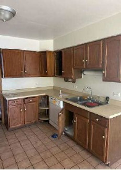 3710 Briar Lane Hazel Crest, IL 60429 - Photo 9 of 27 a kitchen with a sink stove top oven and cabinets