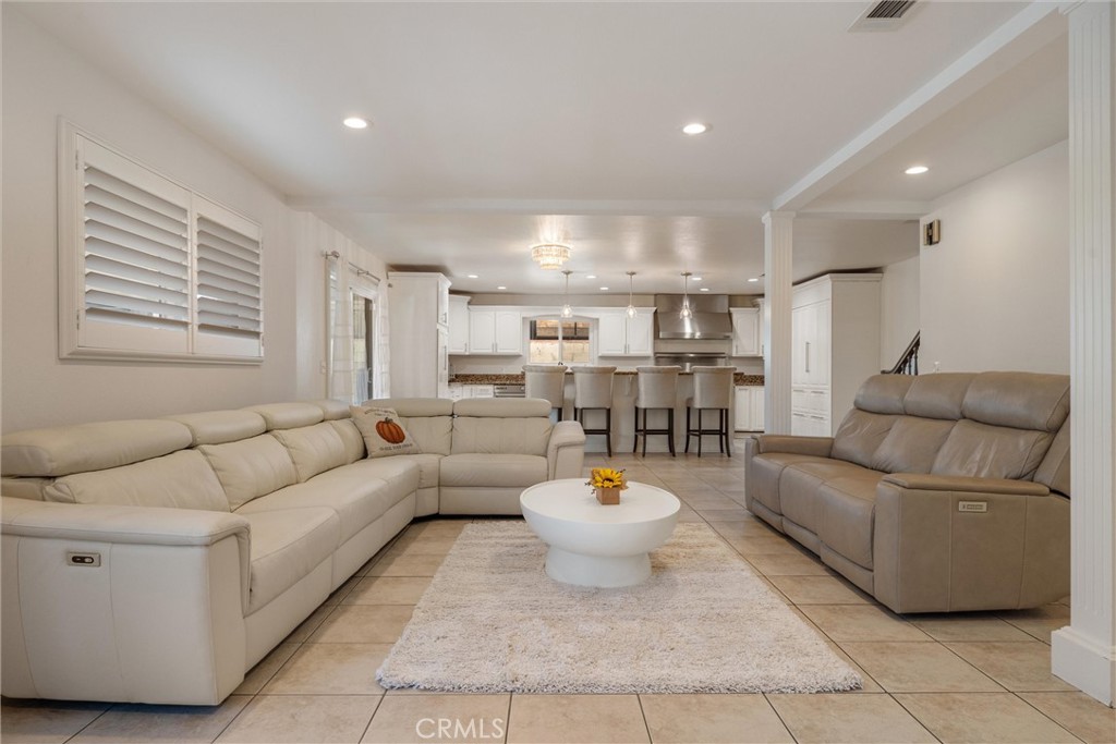 9434 Pico Vista Road Downey, CA 90240 - Photo 16 of 51 a living room with furniture and a wooden floor