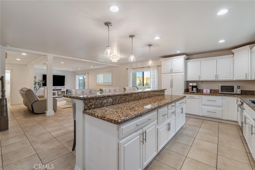 9434 Pico Vista Road Downey, CA 90240 - Photo 19 of 51 a kitchen with stainless steel appliances granite countertop a stove a sink and a refrigerator