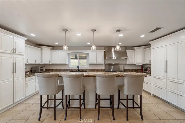a view of a hallway and a livingroom with furniture