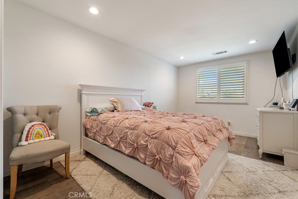 9434 Pico Vista Road Downey, CA 90240 - Photo 31 of 51 a bedroom with a bed and a flat screen tv