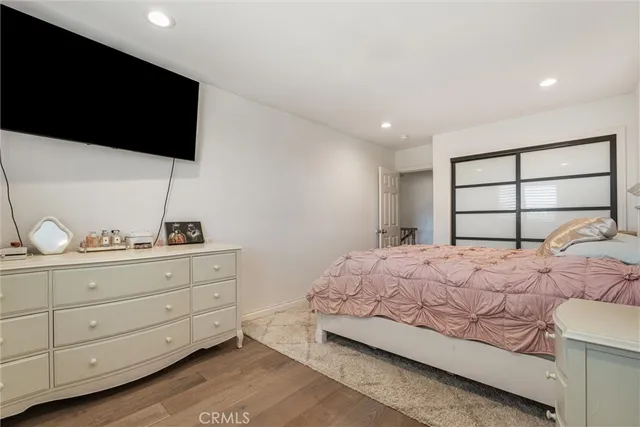 a spacious bathroom with a double vanity sink a mirror and a shower