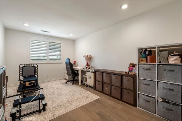a living room with furniture a air conditioner and a window