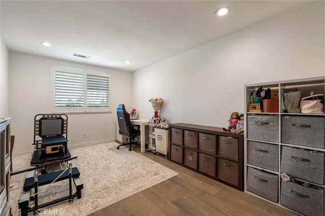 a living room with furniture a air conditioner and a window