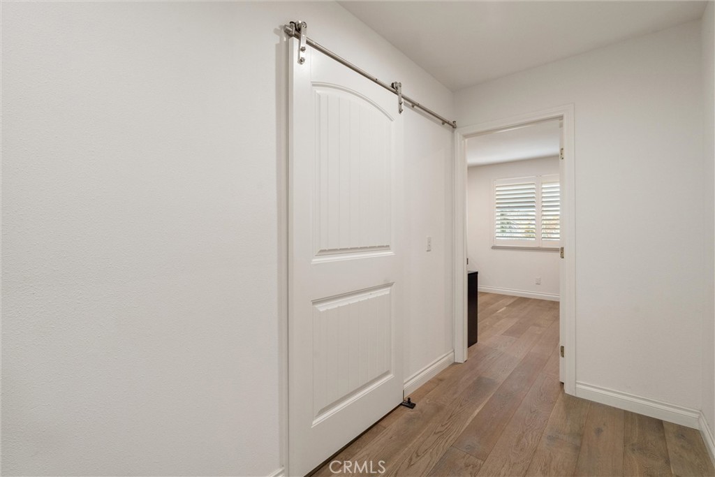 9434 Pico Vista Road Downey, CA 90240 - Photo 40 of 51 a view of an empty walk in closet with wooden floor