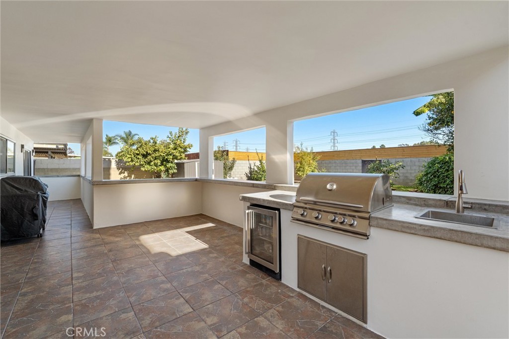 9434 Pico Vista Road Downey, CA 90240 - Photo 46 of 51 a kitchen with stainless steel appliances a stove a microwave and a refrigerator