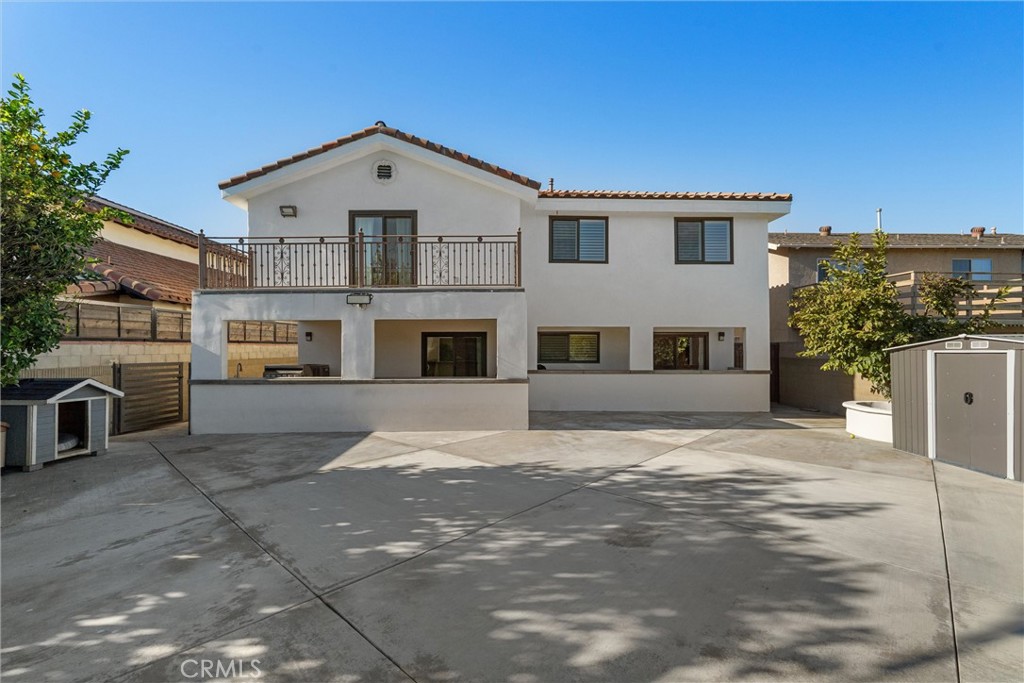 9434 Pico Vista Road Downey, CA 90240 - Photo 50 of 51 a front view of a house with a yard