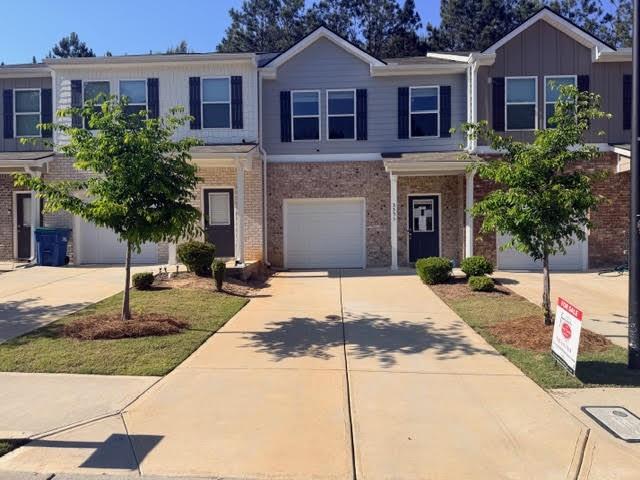 3353 Sable Elm Court Atlanta, GA 30349 - Photo 1 of 18 a house with palm tree in front of it