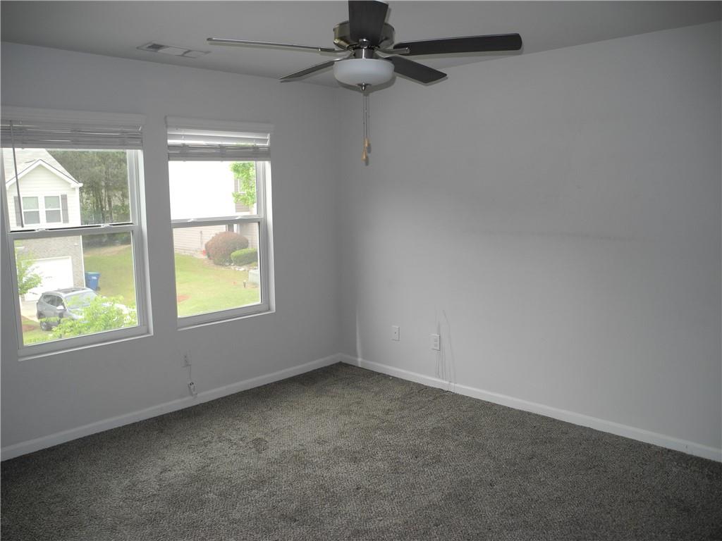 3353 Sable Elm Court Atlanta, GA 30349 - Photo 12 of 18 an empty room with windows