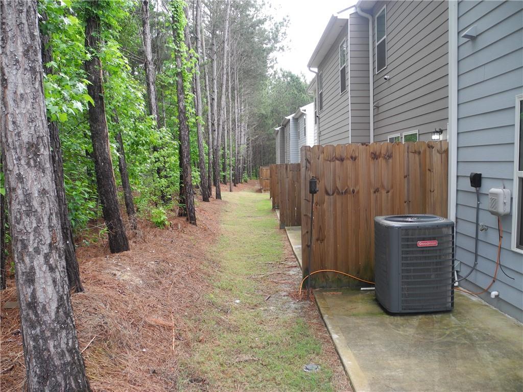 3353 Sable Elm Court Atlanta, GA 30349 - Photo 17 of 18 a view of a wooden door and a yard