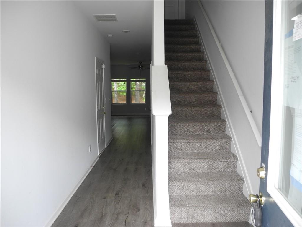 3353 Sable Elm Court Atlanta, GA 30349 - Photo 2 of 18 a view of entryway and hall with wooden floor