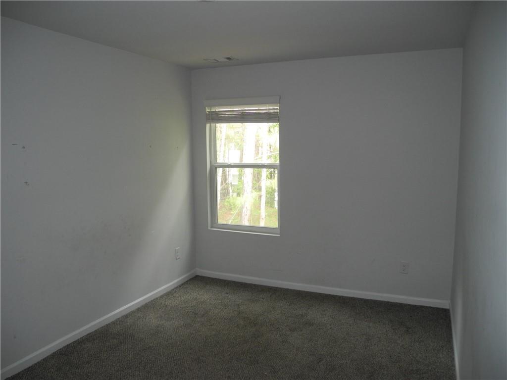 3353 Sable Elm Court Atlanta, GA 30349 - Photo 9 of 18 an empty room with a window