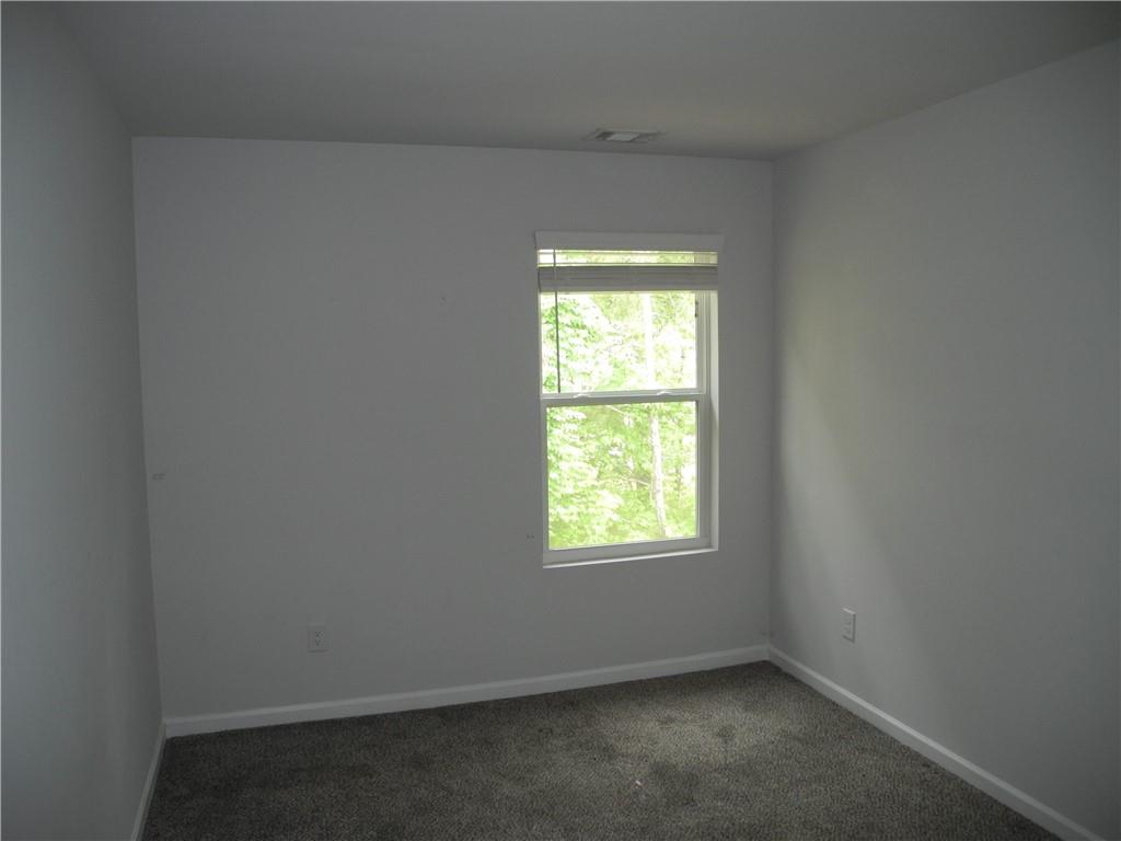 3353 Sable Elm Court Atlanta, GA 30349 - Photo 10 of 18 an empty room with a window