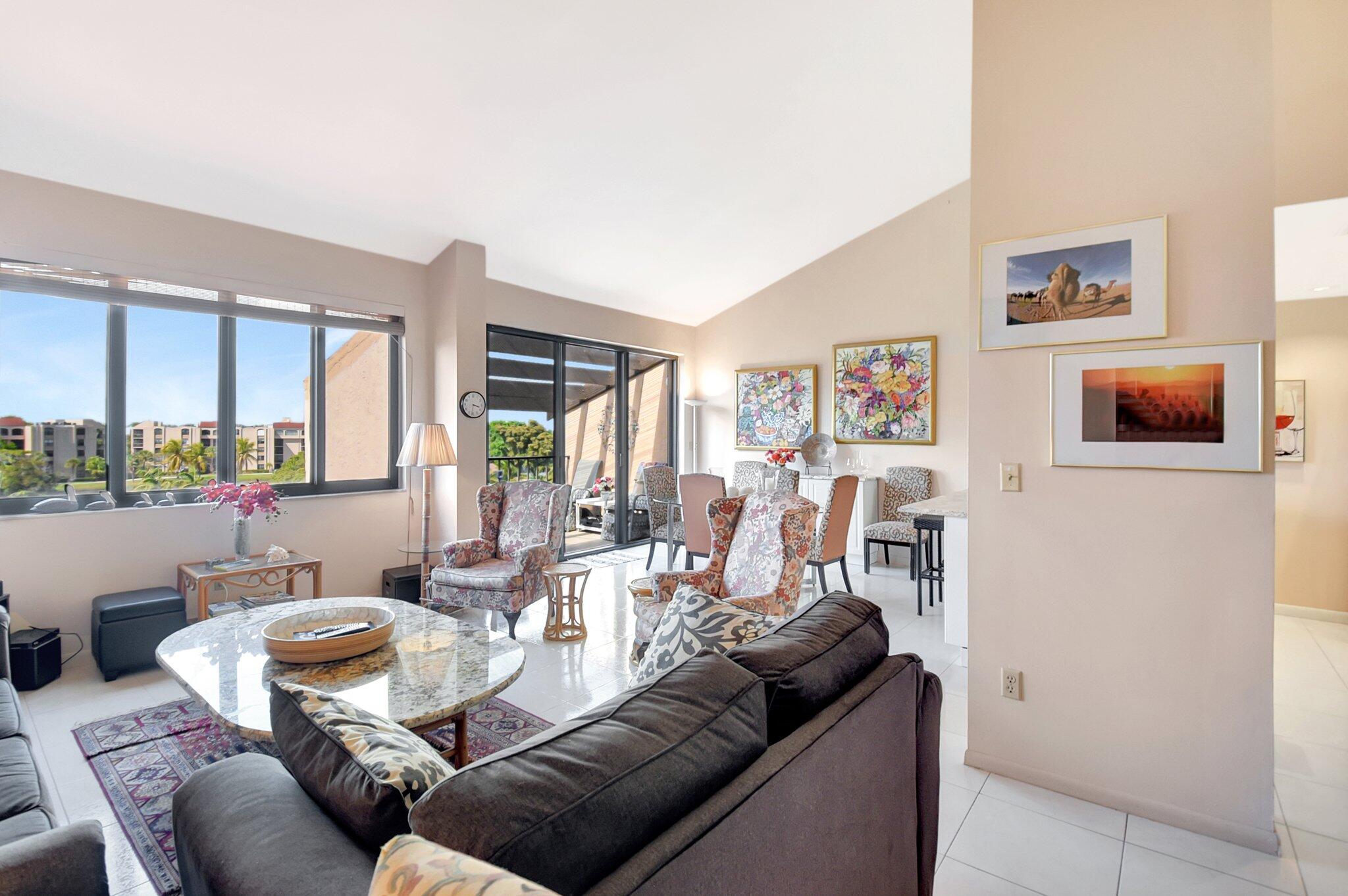 755 Dotterel Road, Unit 1512 Delray Beach, FL 33444 - Photo 11 of 48 a living room with furniture and a floor to ceiling window