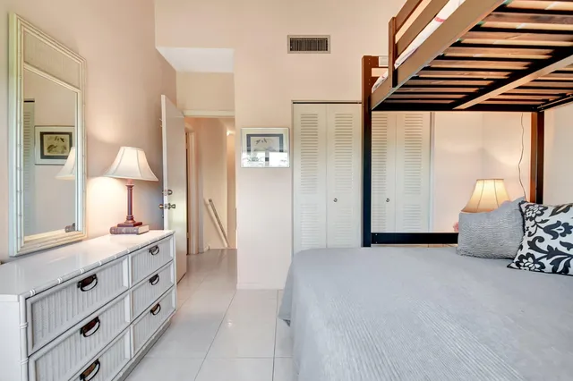 a view of hallway with cabinets and a window