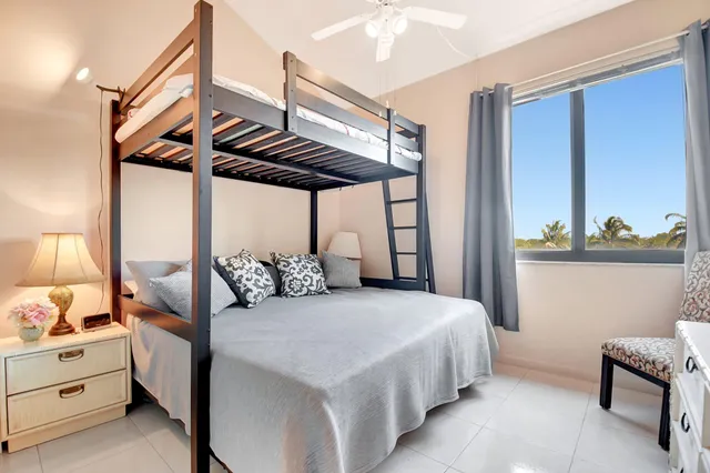 a bedroom with a bed and a table