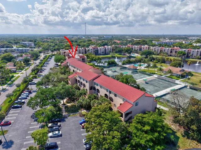 an aerial view of a houses with a swimming pool