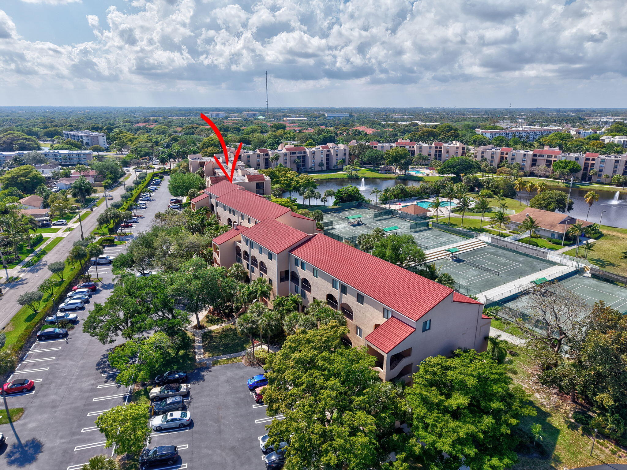 755 Dotterel Road, Unit 1512 Delray Beach, FL 33444 - Photo 31 of 48 an aerial view of a houses with a swimming pool