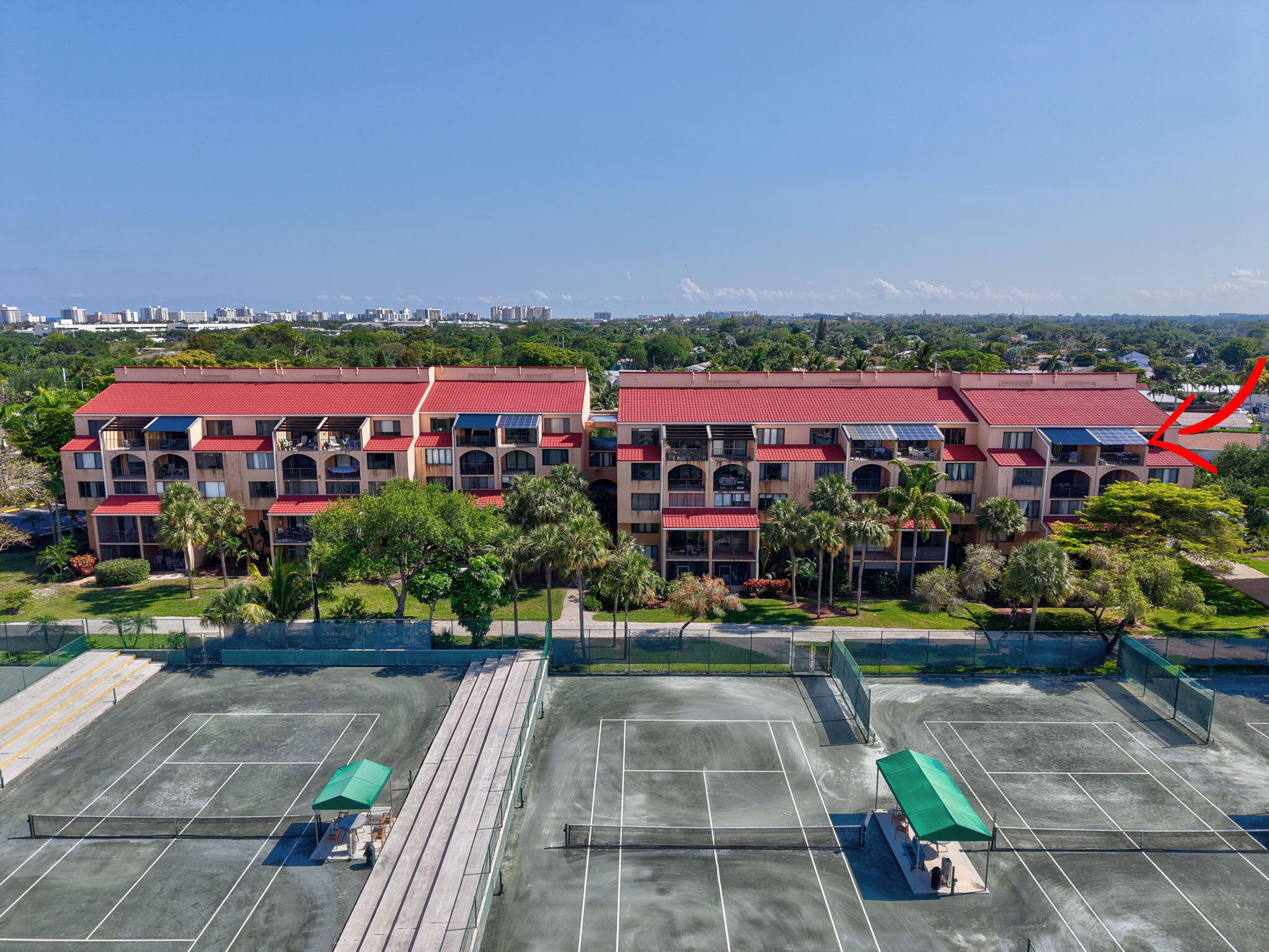 755 Dotterel Road, Unit 1512 Delray Beach, FL 33444 - Photo 35 of 48 a view of swimming pool in front of residential houses with outdoor space
