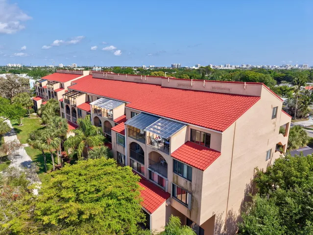 an aerial view of a house with a swimming pool and outdoor space