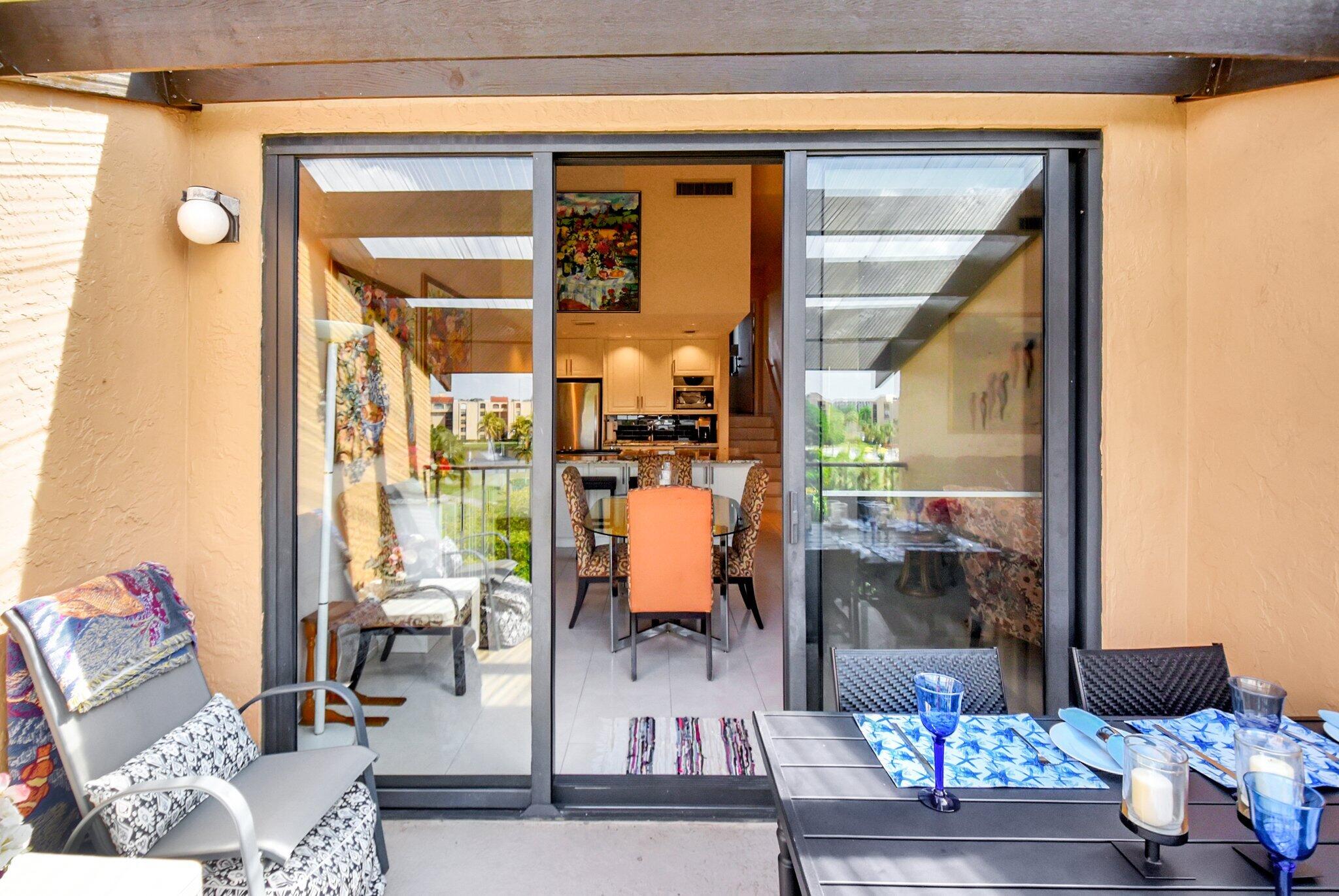 755 Dotterel Road, Unit 1512 Delray Beach, FL 33444 - Photo 48 of 48 a living room filled with furniture and a window