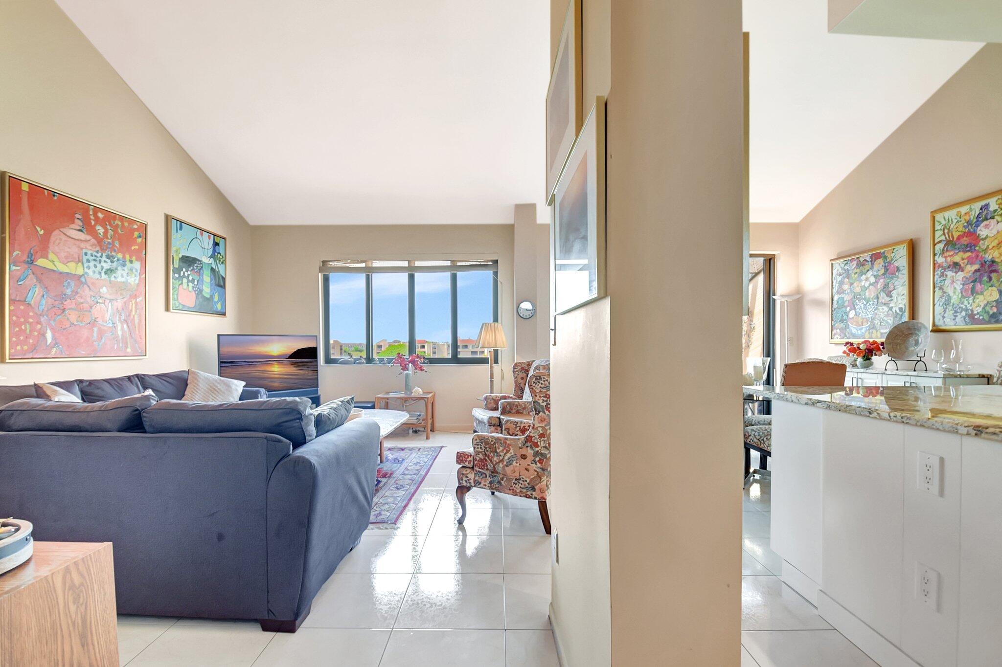 755 Dotterel Road, Unit 1512 Delray Beach, FL 33444 - Photo 8 of 48 a living room with furniture and a flat screen tv