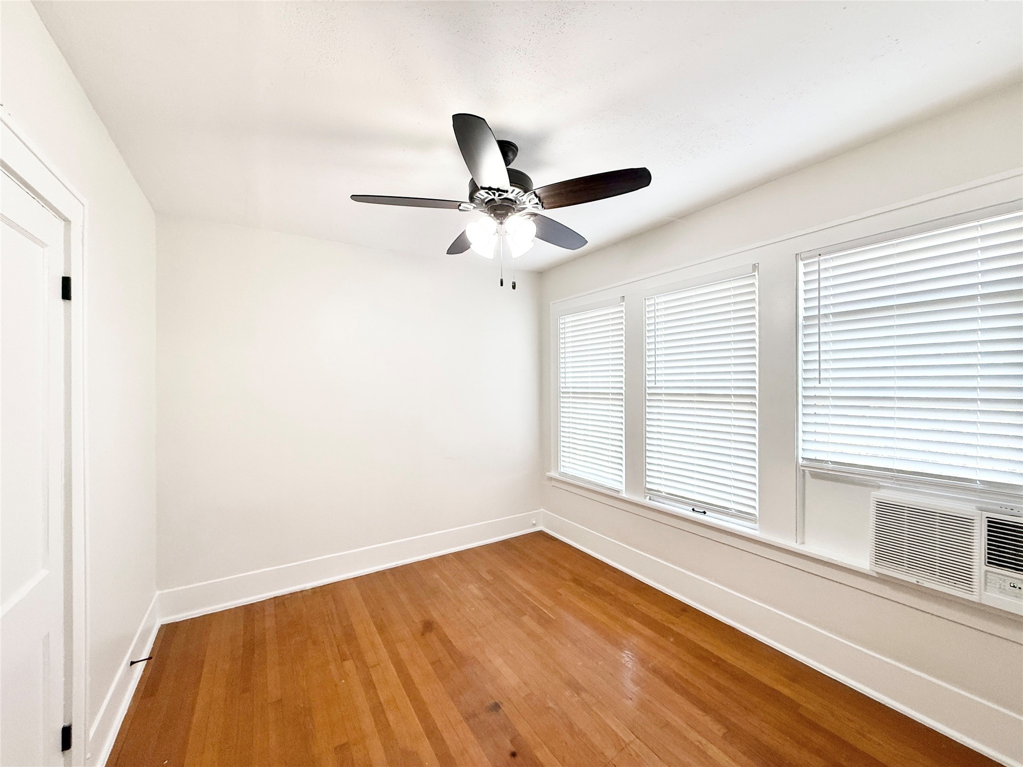 1126 Berthea Street, Unit 16 Houston, TX 77006 - Photo 12 of 16 a view of an empty room with a window