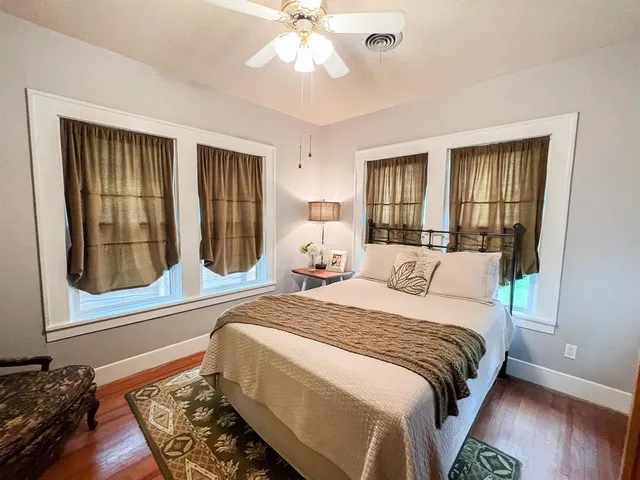 a bedroom with a bed furniture and a book shelf