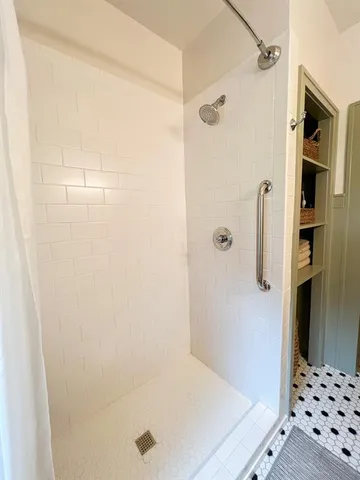 a bedroom with bed and window