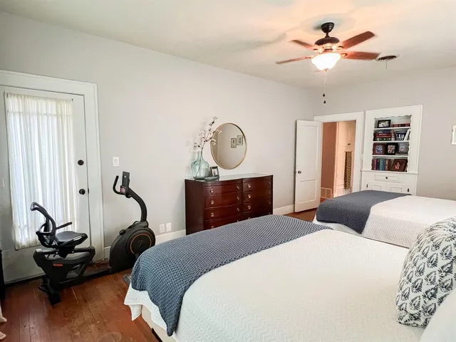 a bedroom with bed and window