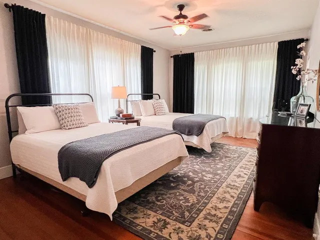 a bathroom with a sink mirror and toilet