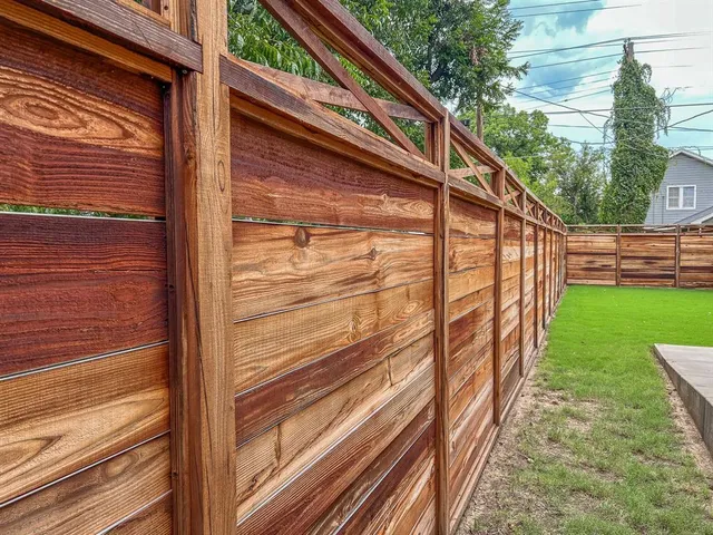 a stove top oven sitting inside of a kitchen and stainless steel appliances