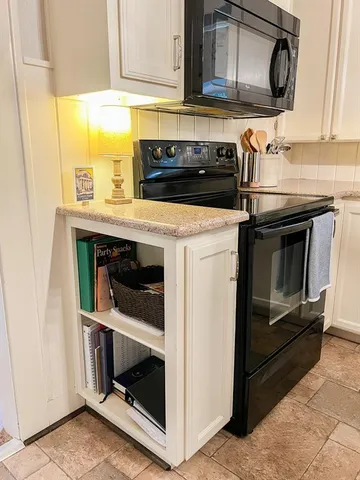 a view of a room with lots of gym equipment