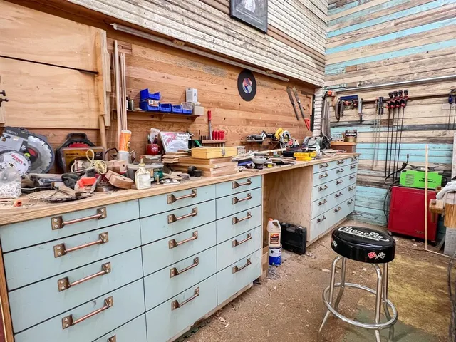 a view of parking garage with cars