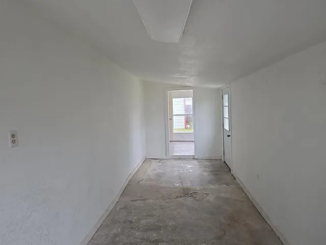 a view of hallway with windows
